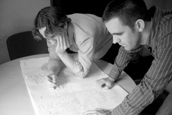 DH Ryan photo of Donal & Hugh working on design plans